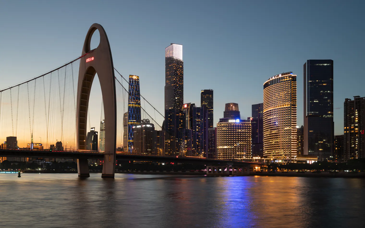 Liede Bridge and the Zhujiang New Town skyline at dusk, Guangzhou, China