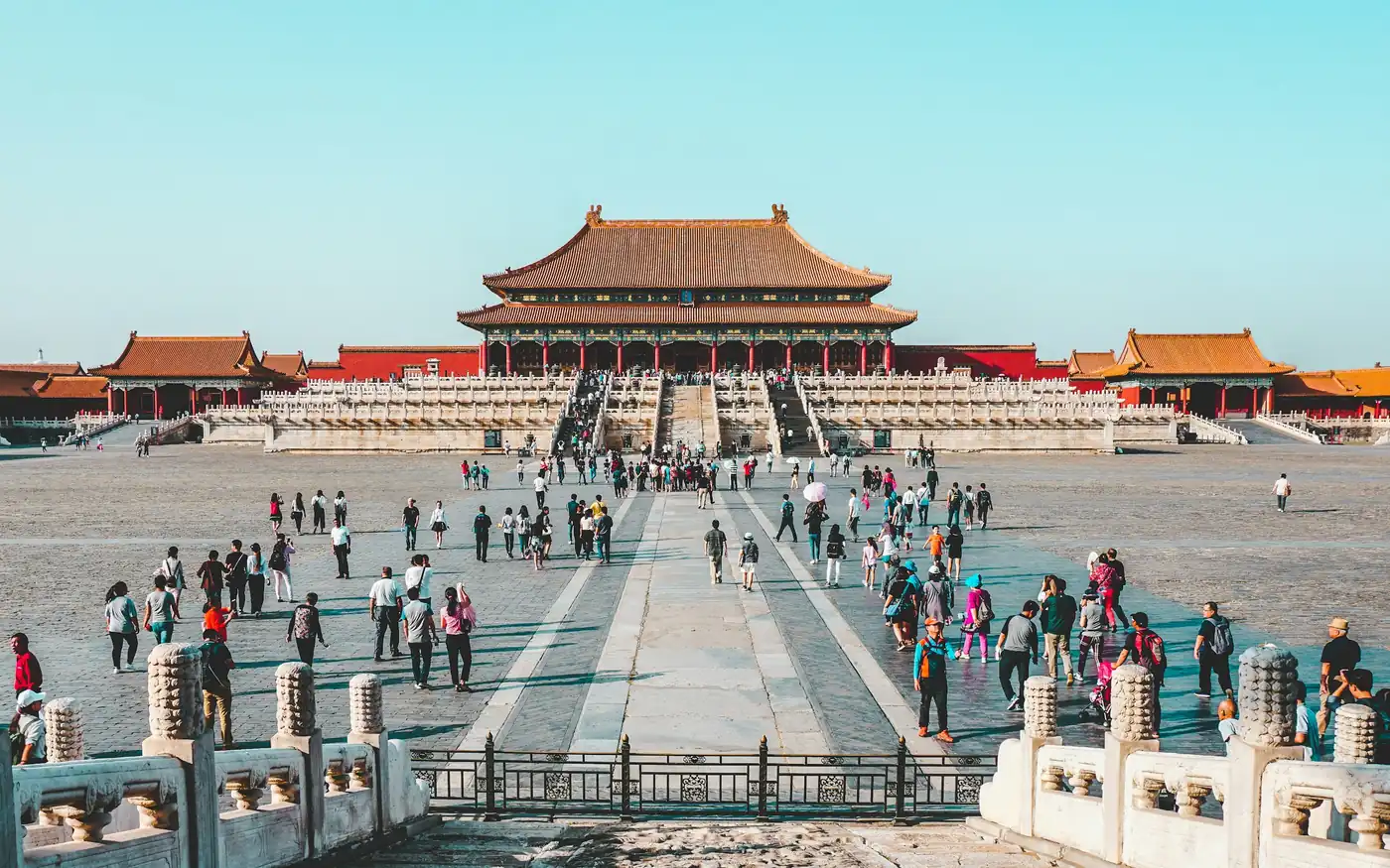 Visitors crossing the courtyard in front of the Hall of Supreme Harmony, Forbidden City, Beijing, China