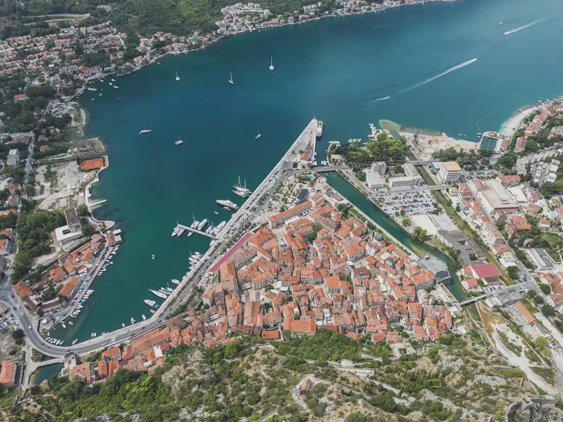 Aerial view of Kotor's walled old town and fjord-like bay in Montenegro